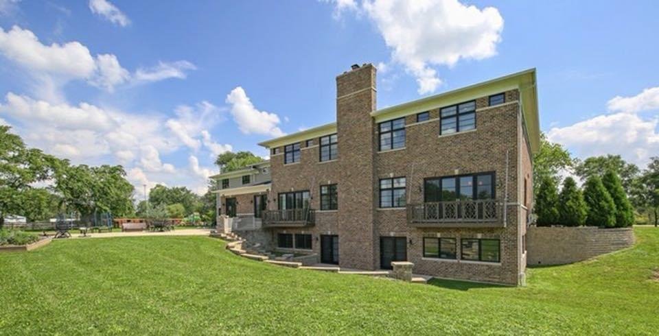 Front exterior of a custom brick two-story home built by Zeiler Construction