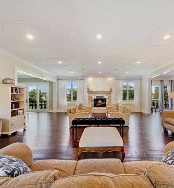 Great room with fireplace and coffered ceiling in a Zeiler Construction custom home